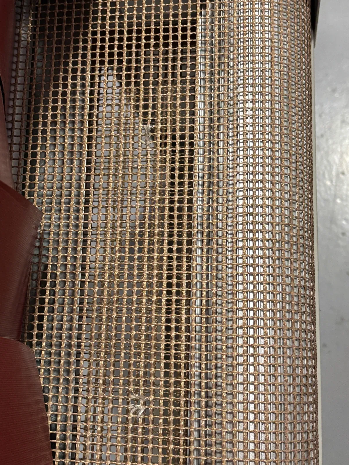 Close-up of the high-temperature perforated canvas belt of the TR tunnel